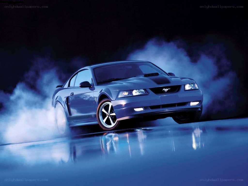 blue mustang performing burnout