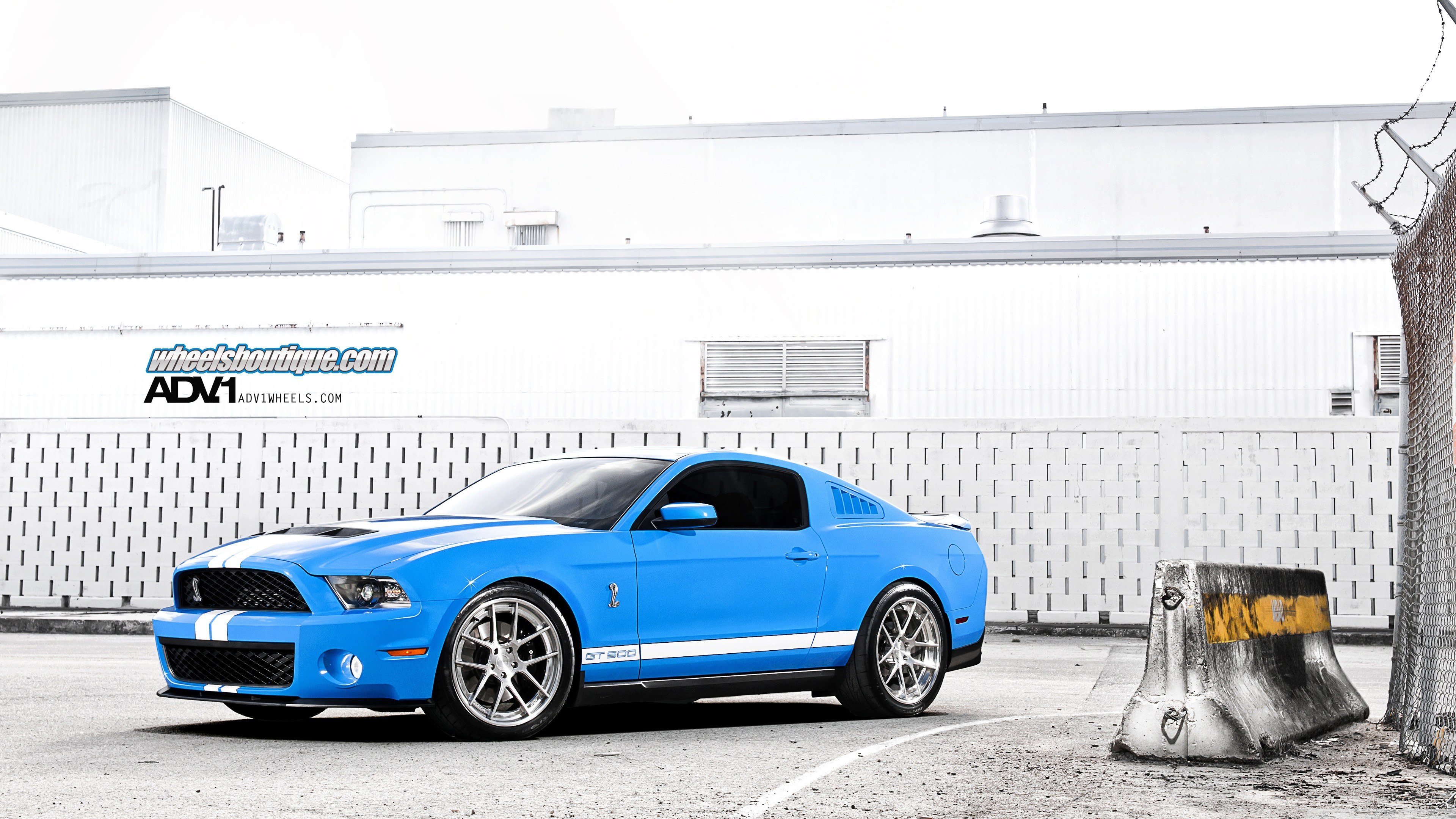 blue mustang with custom wheels