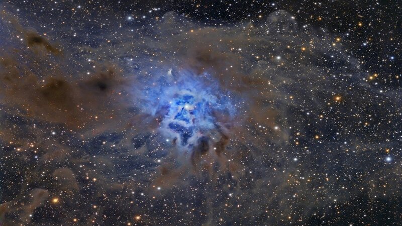 Blue nebula in star field