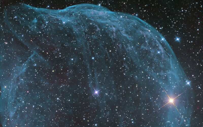 Blue nebula in star field
