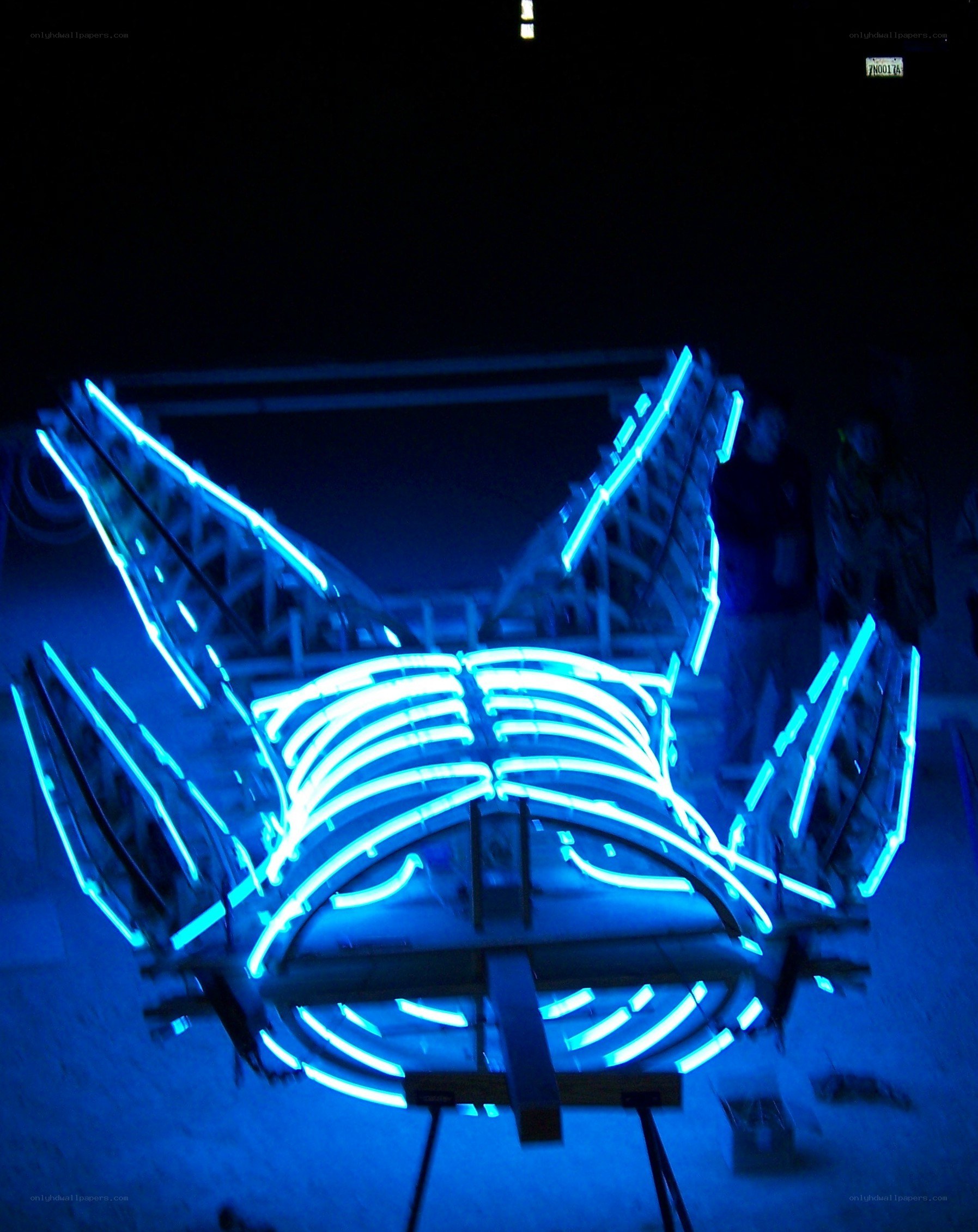 blue neon sculpture at night