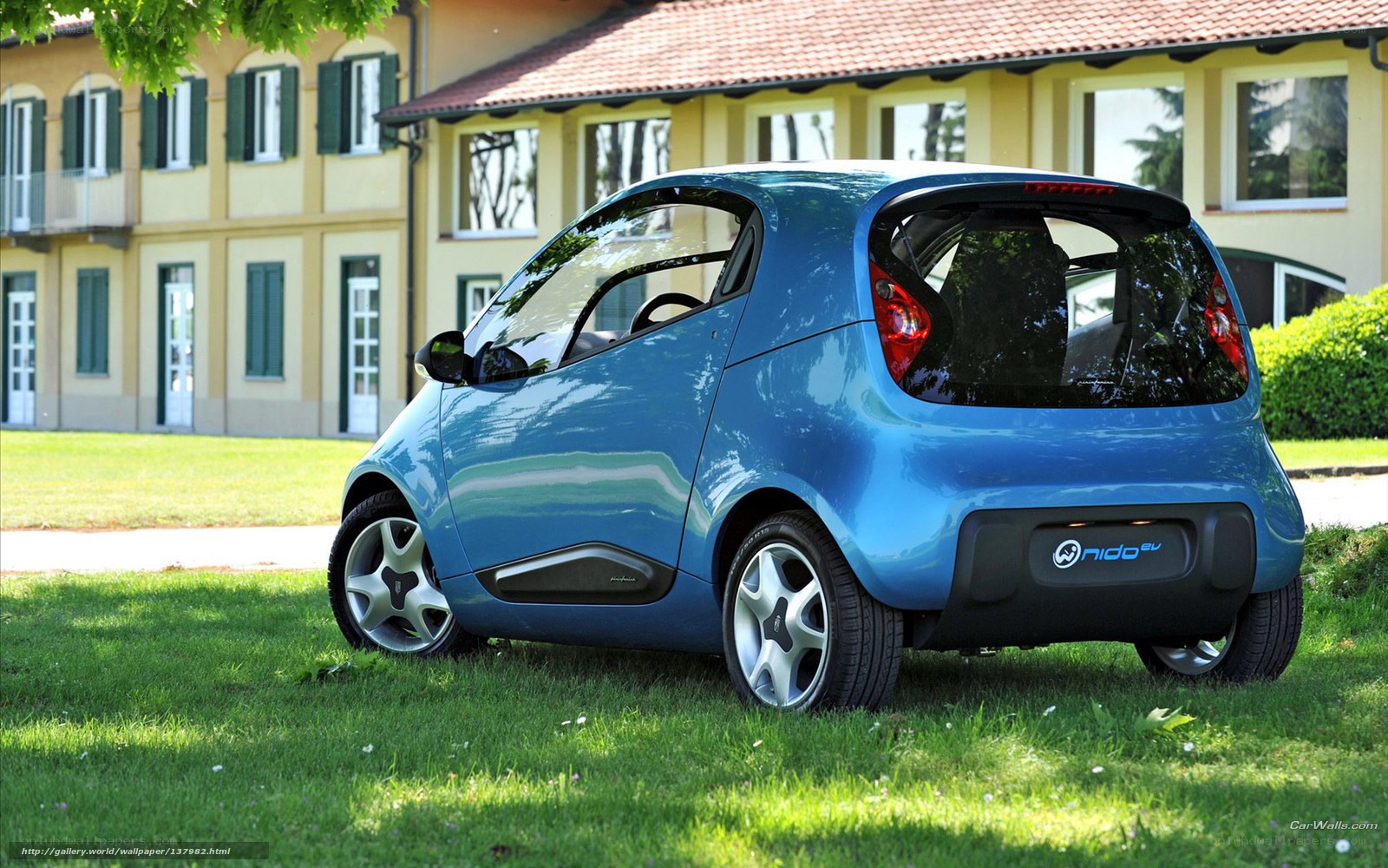 Blue Nido EV car on grass