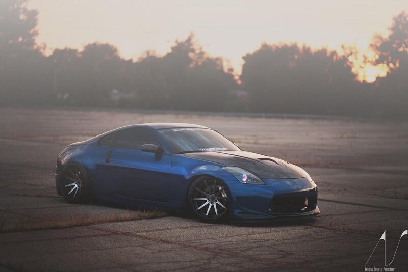 Blue Nissan 350Z at sunset