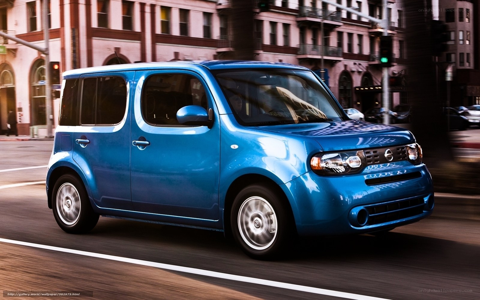 blue nissan cube in city