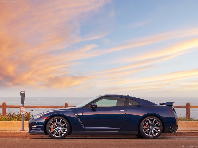 Blue Nissan GT-R by the ocean
