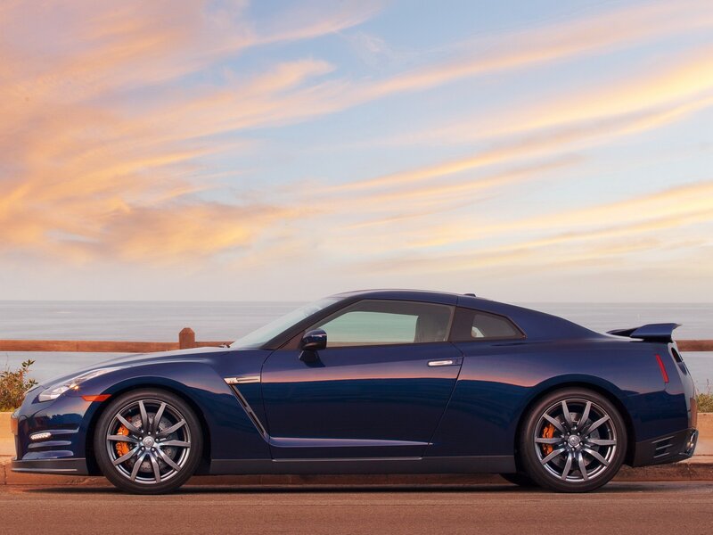 Blue Nissan GT-R by the ocean