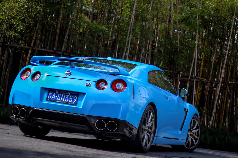 Blue Nissan GT-R in bamboo grove