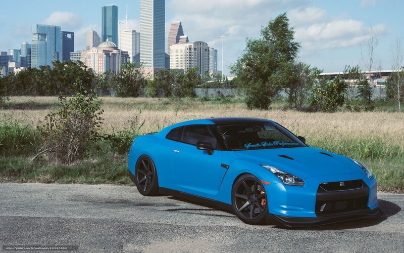 Blue Nissan GT-R in cityscape