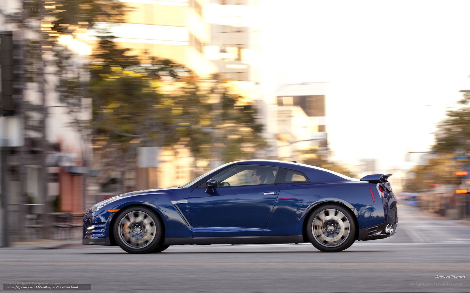 Blue Nissan GT-R in motion