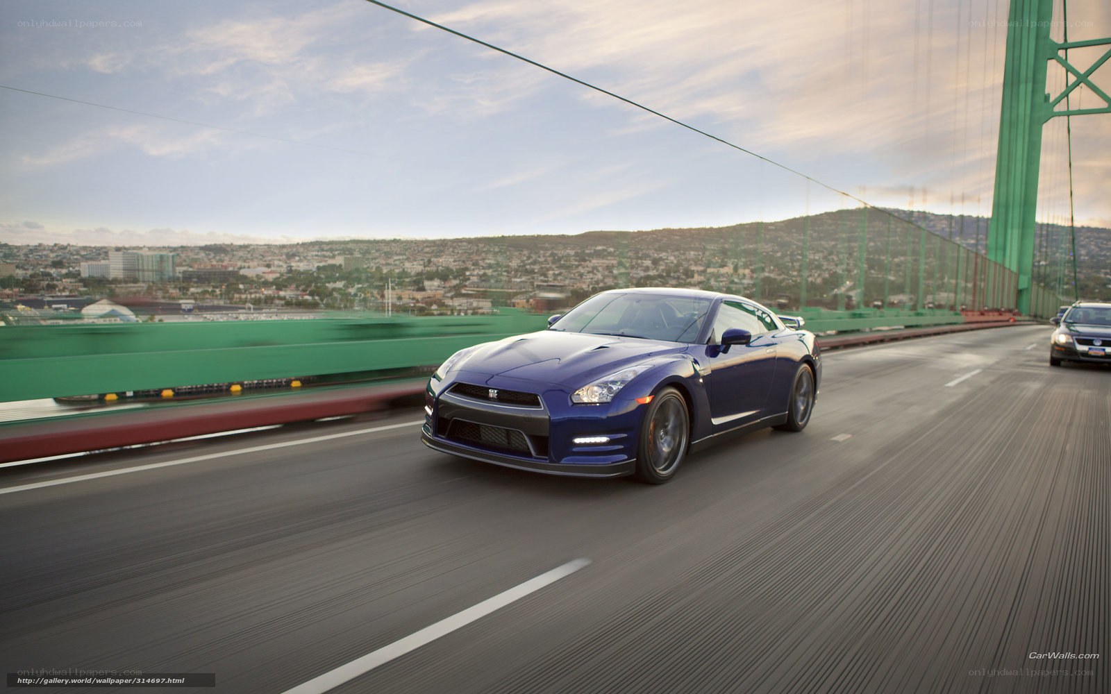 Blue Nissan GT-R on a bridge