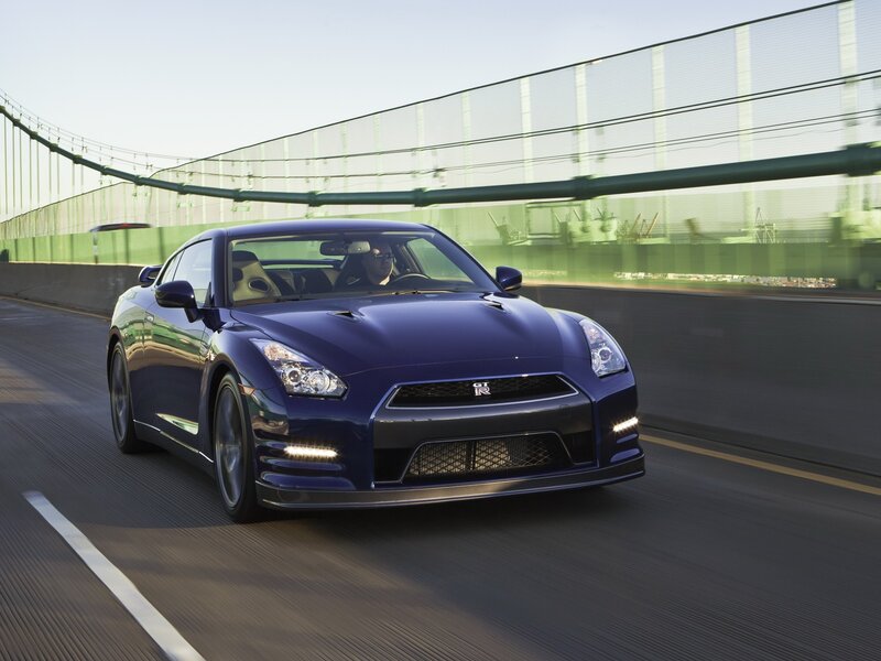 Blue Nissan GT-R on a bridge