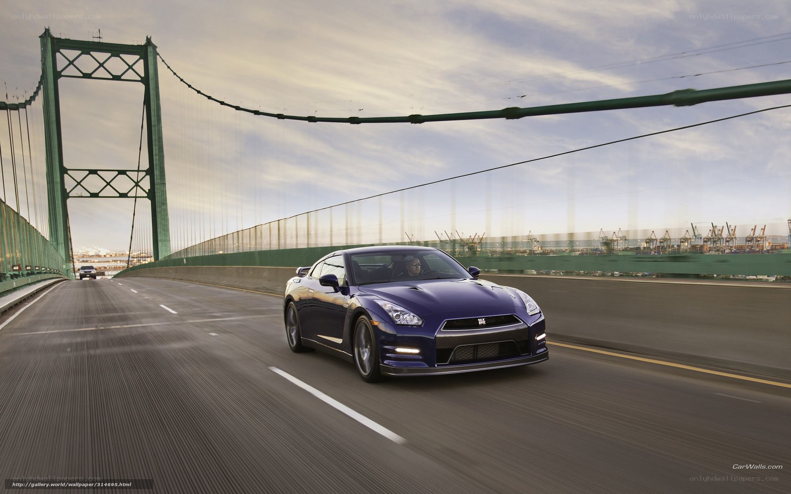 Blue Nissan GT-R on a bridge