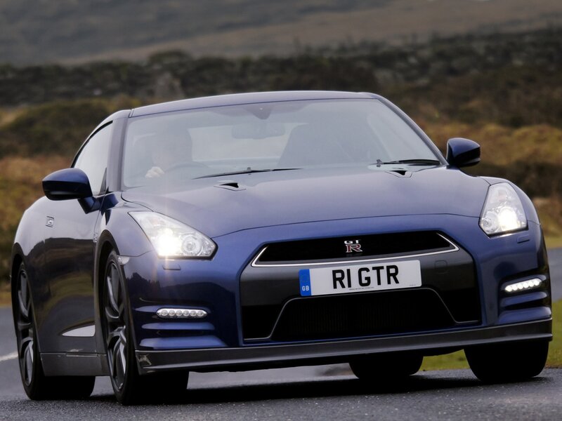 Blue Nissan GT-R on a road