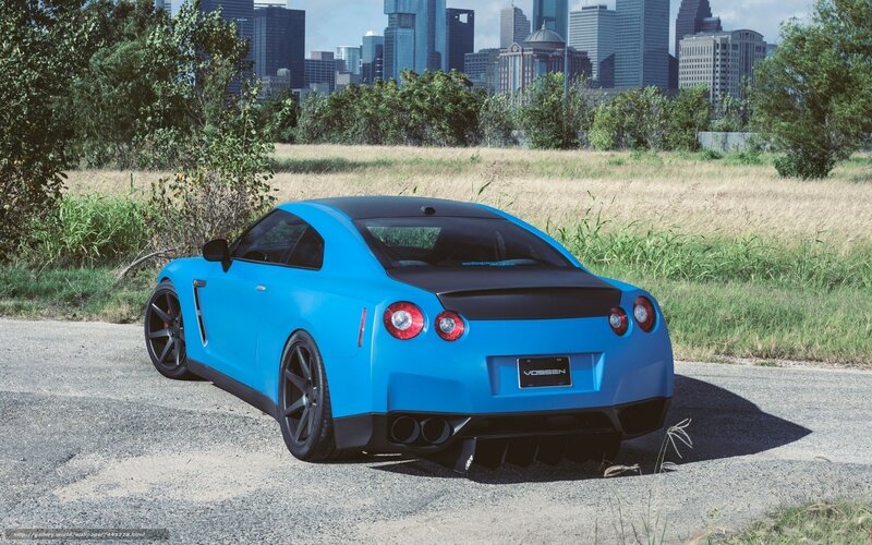 Blue Nissan GT-R on a road