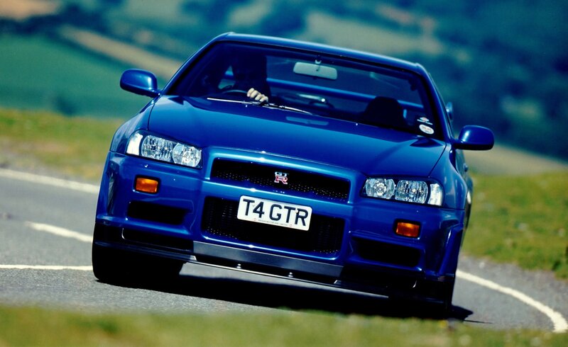 Blue Nissan GT-R on a winding road