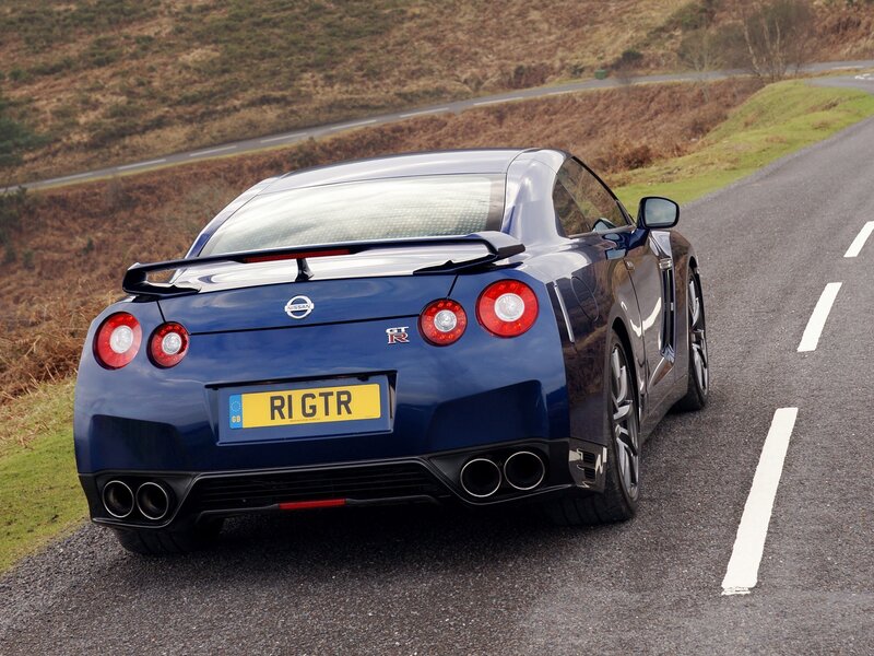 Blue Nissan GT-R on a winding road