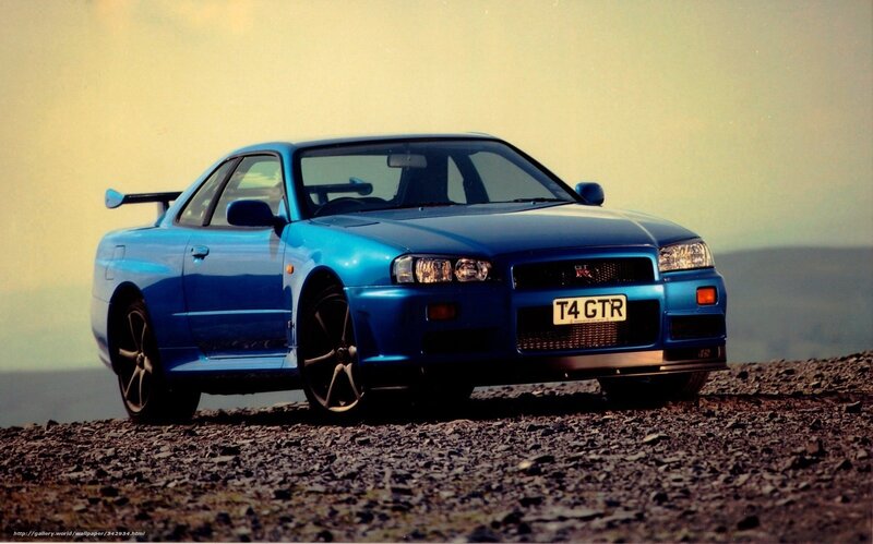 Blue Nissan GT-R on gravel