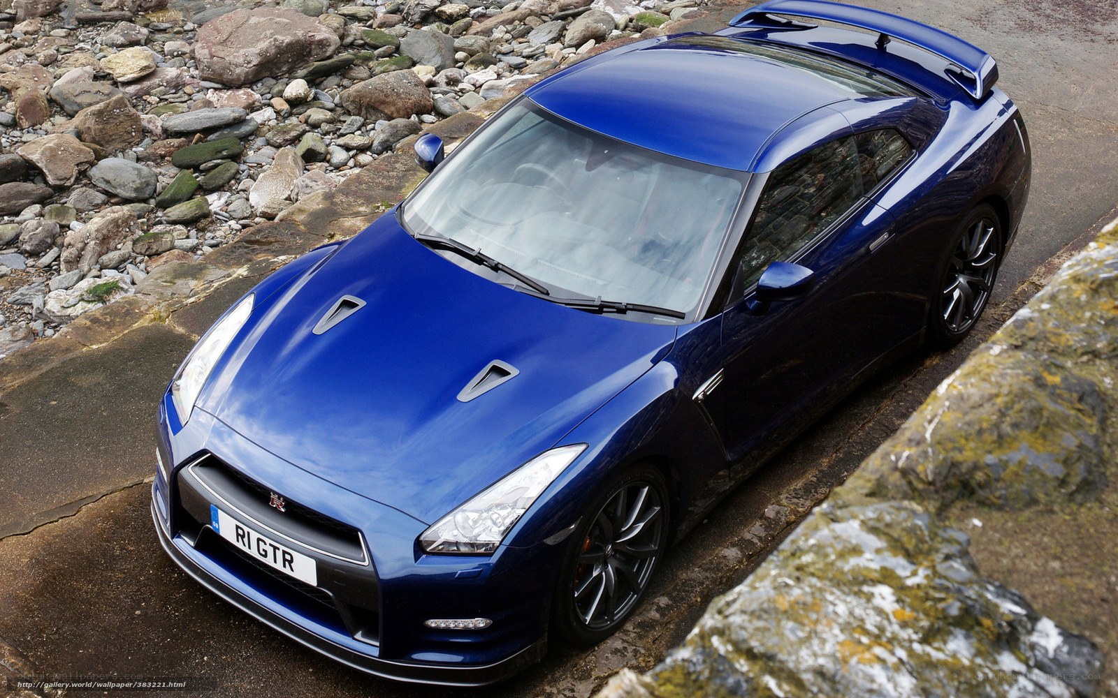 Blue Nissan GT-R on rocky path