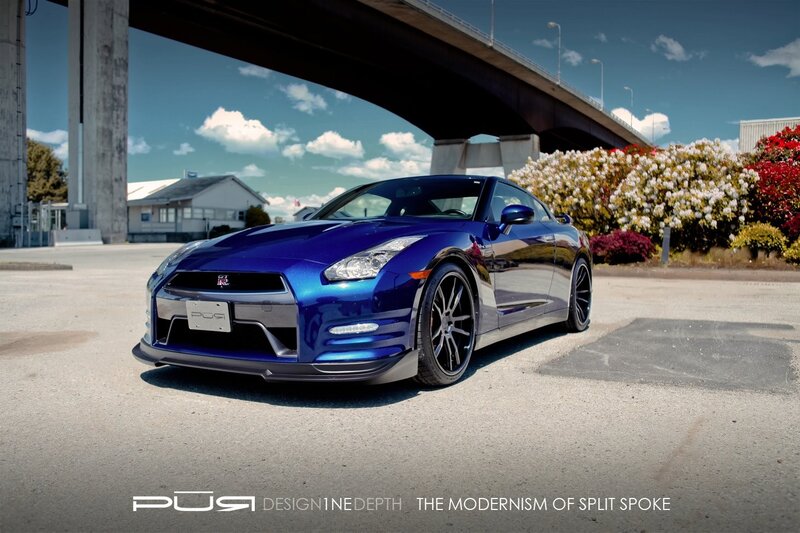 Blue Nissan GT-R under bridge