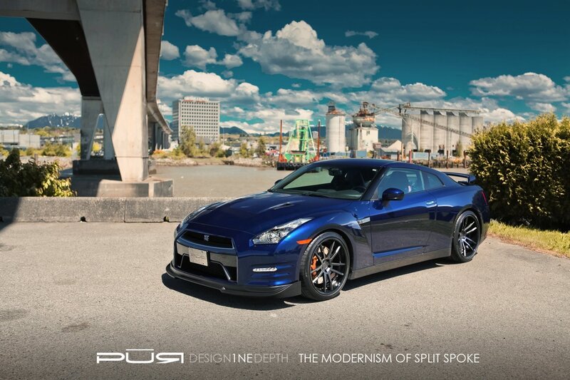 Blue Nissan GT-R under bridge