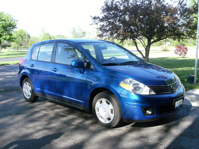 blue nissan hatchback car