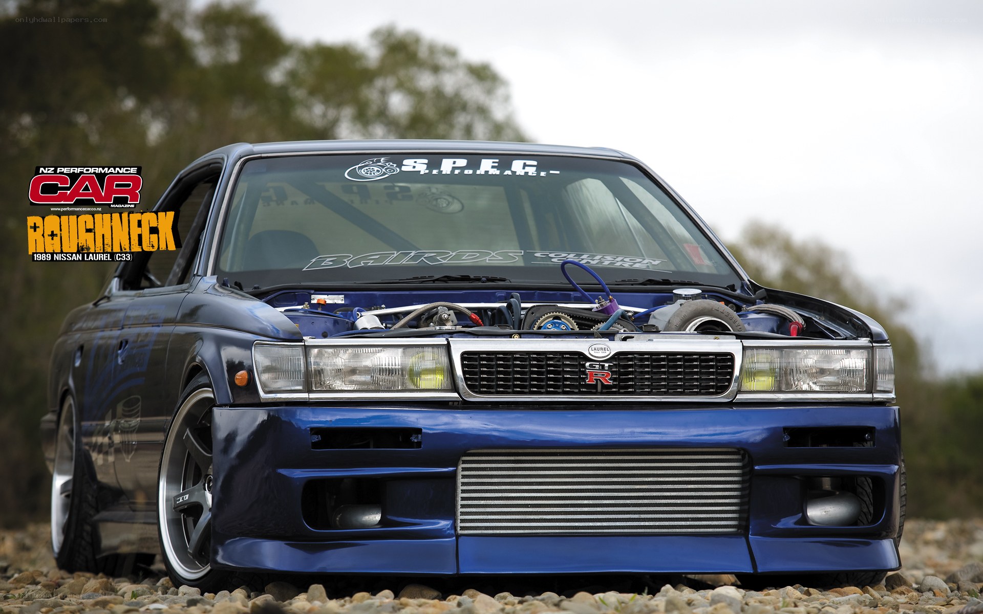 Blue Nissan Laurel C33