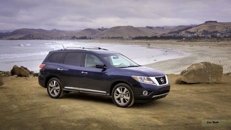 Blue Nissan Pathfinder on beach