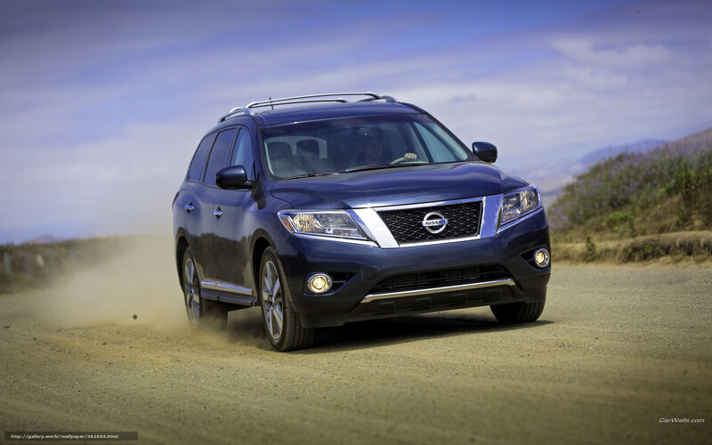 Blue Nissan Rogue on dirt road