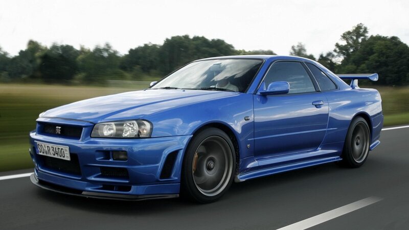 blue nissan skyline gtr in motion