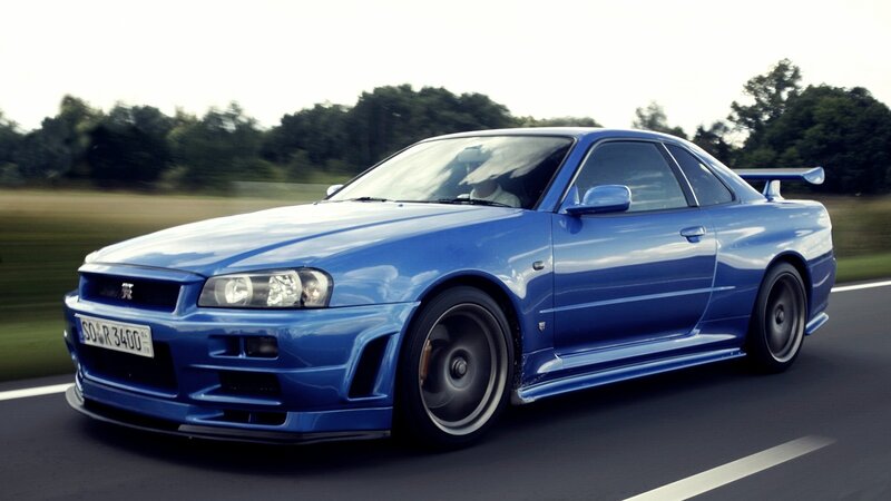 blue nissan skyline gtr on road