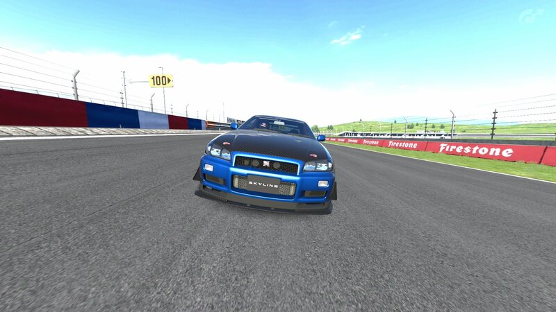 Blue Nissan Skyline on a racetrack