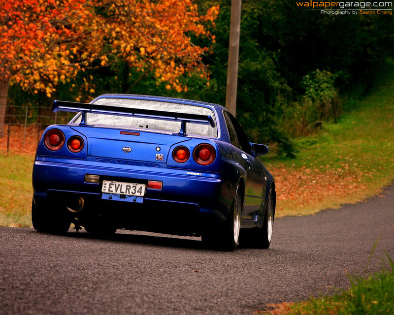 blue nissan skyline on road
