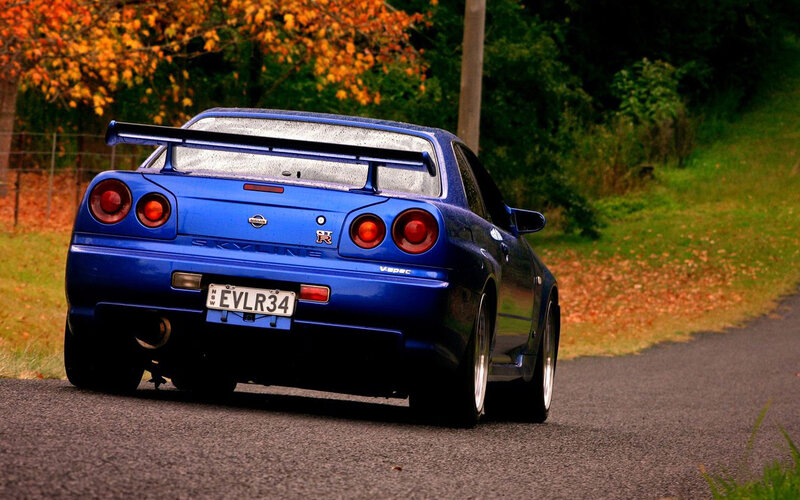 blue nissan skyline on road