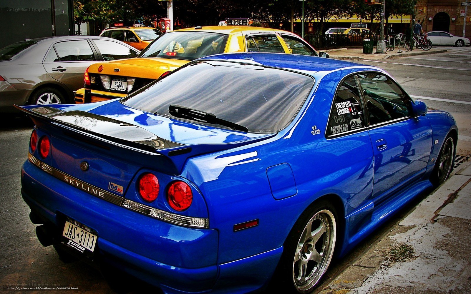 Blue Nissan Skyline parked on street