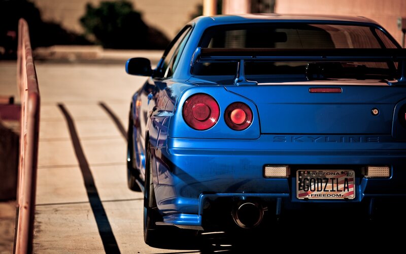 blue nissan skyline rear view