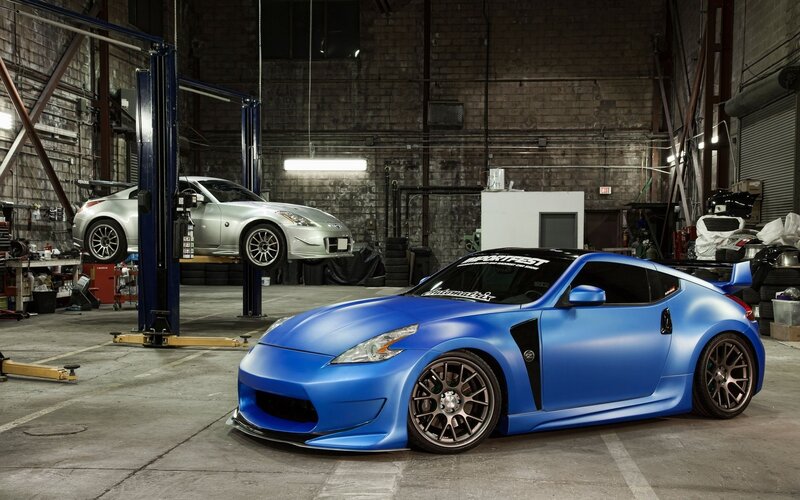 Blue Nissan sports car in garage