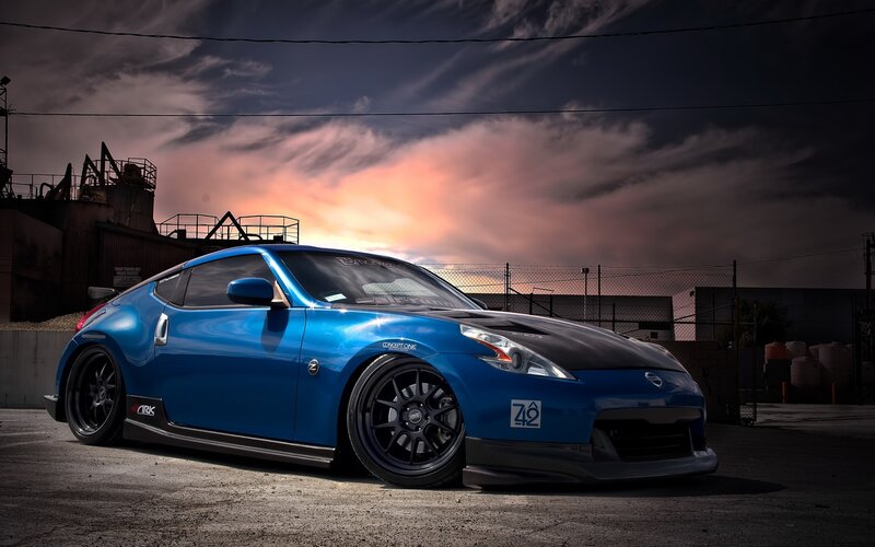 Blue Nissan Z car at sunset