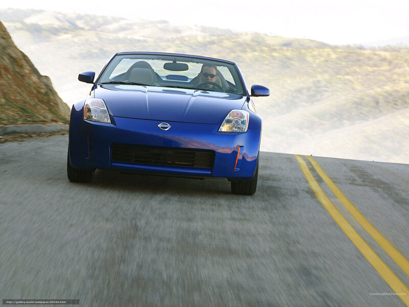 Blue Nissan Z driving on a road
