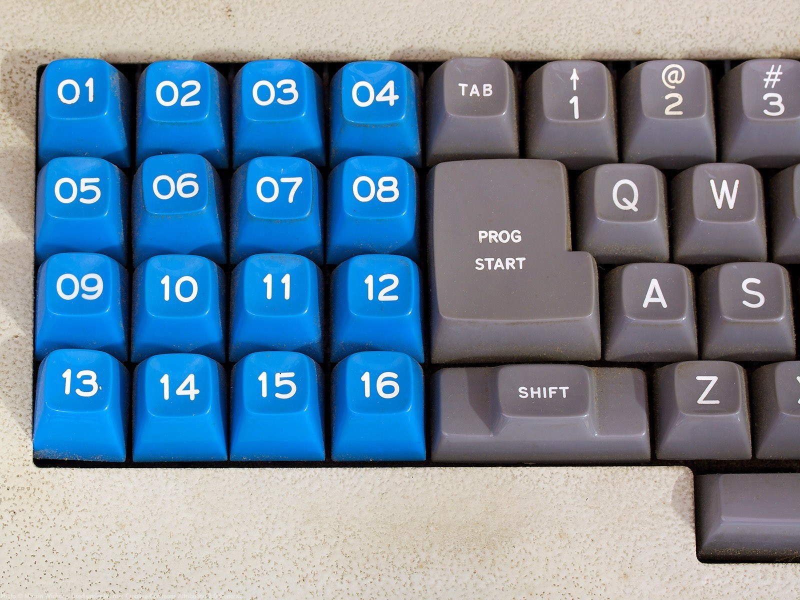 blue numeric keypad on vintage keyboard