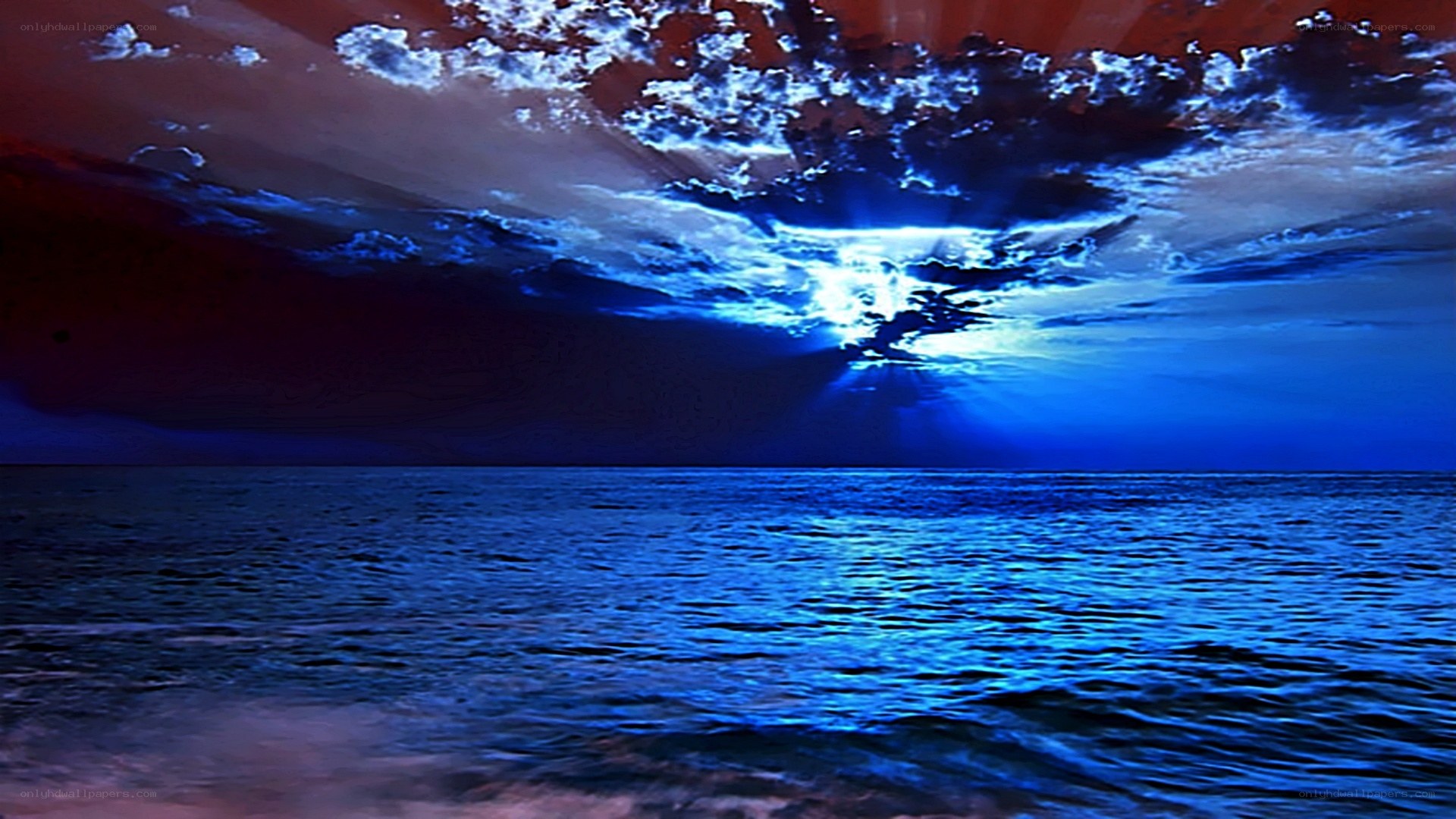 blue ocean under dramatic sky