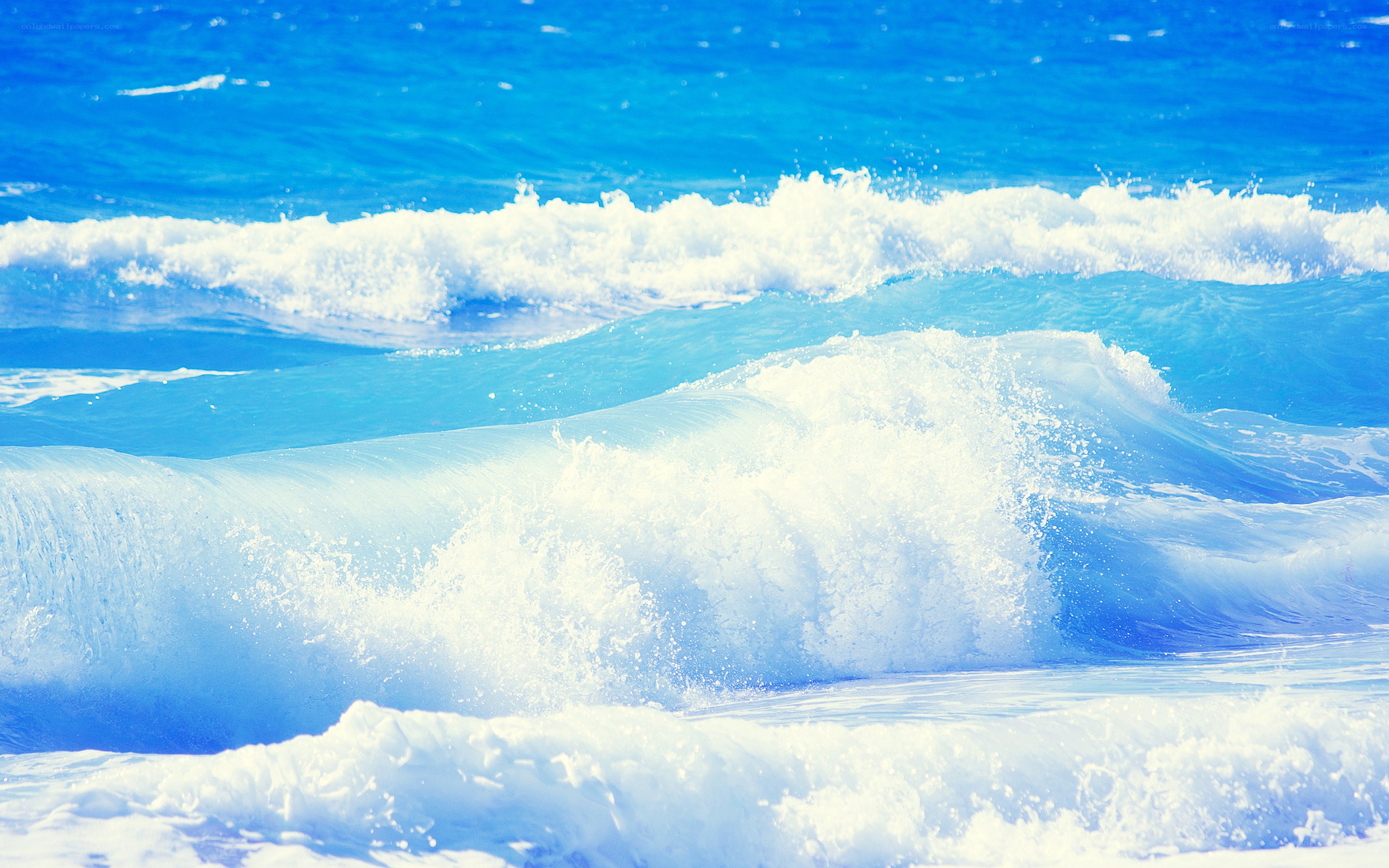 Blue ocean waves crashing
