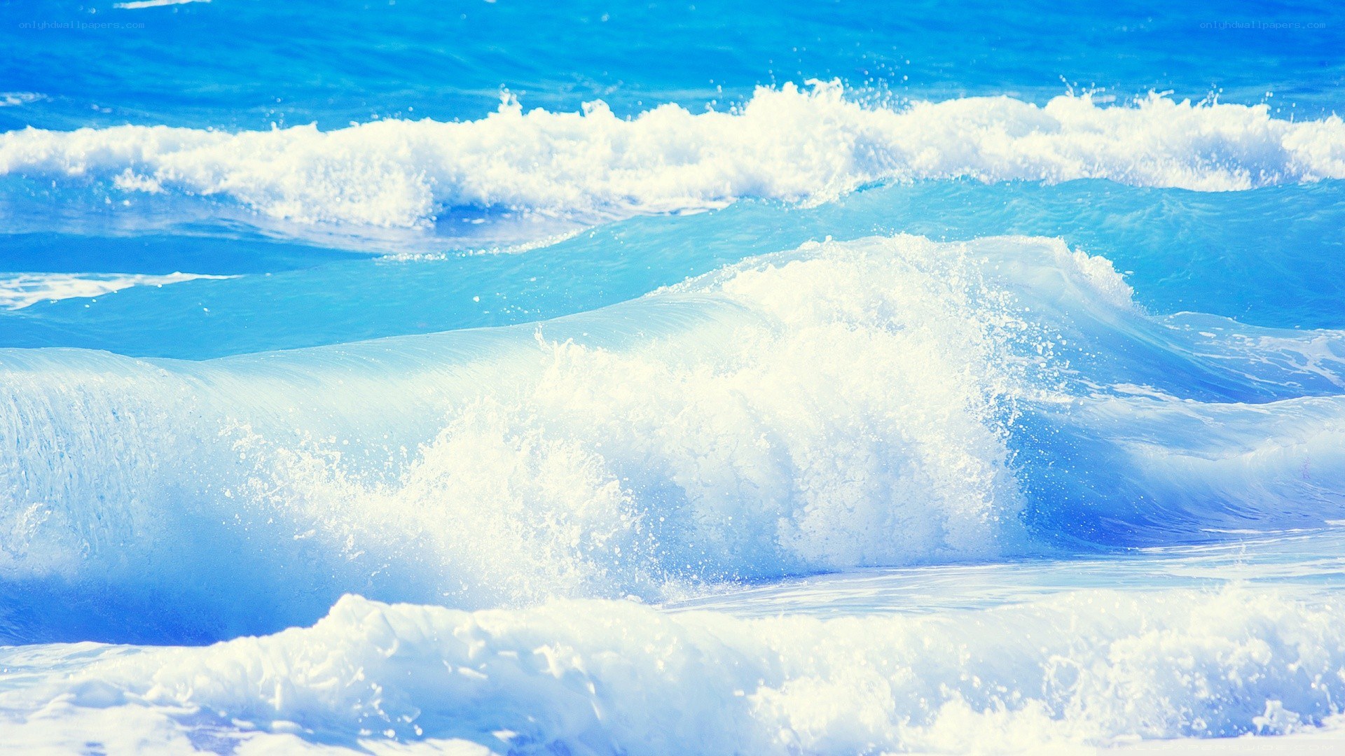 Blue ocean waves crashing