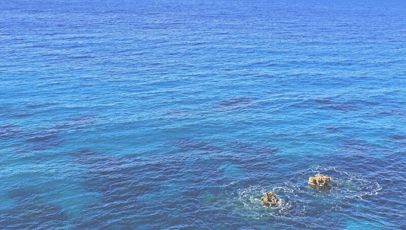 Blue ocean with rocks
