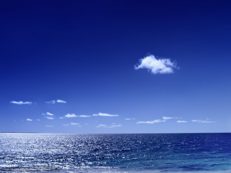 Blue ocean with single cloud