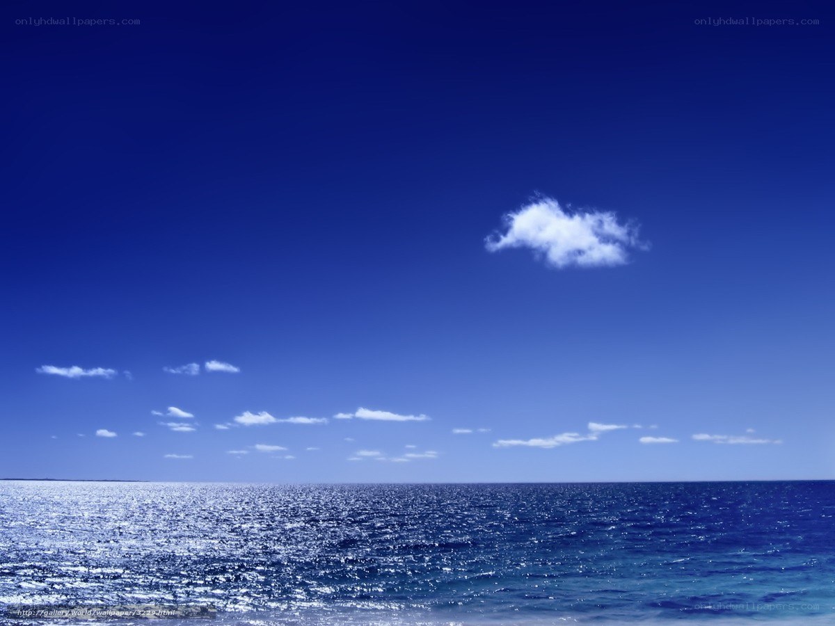 Blue ocean with single cloud