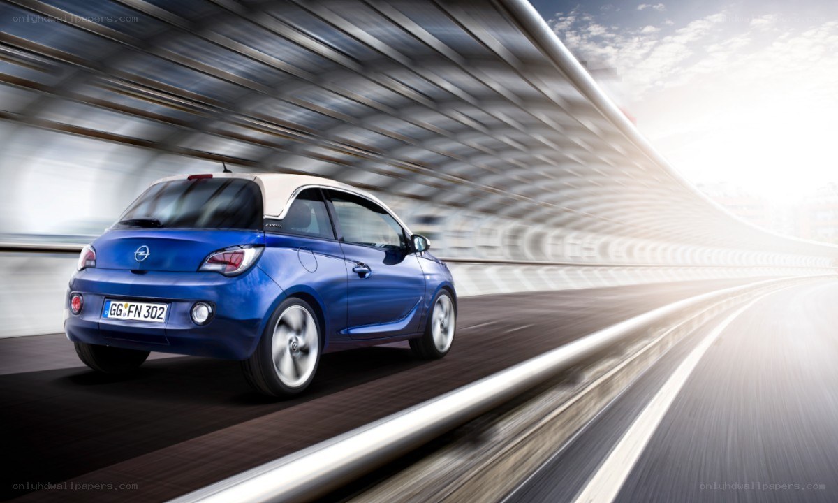Blue Opel Adam on a highway