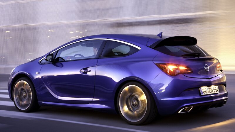 blue opel astra gtc in motion