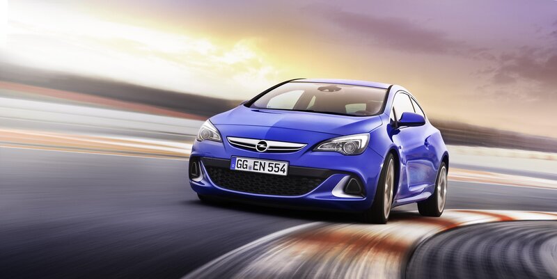 Blue Opel Astra on a racetrack
