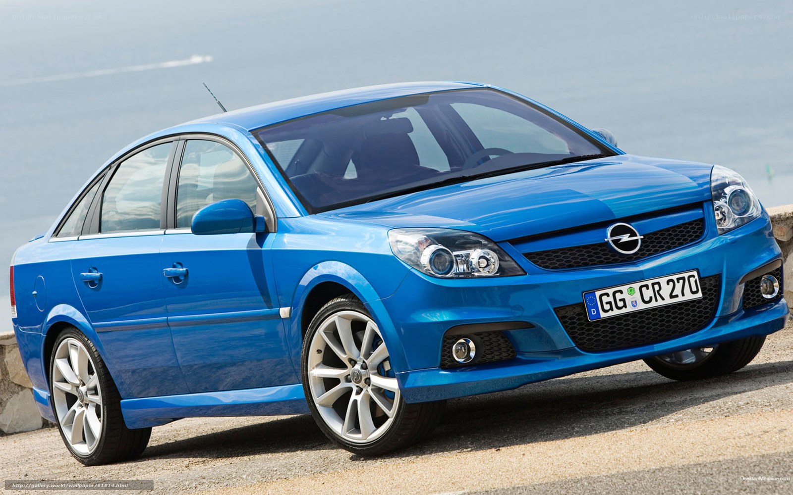 blue opel car by the sea