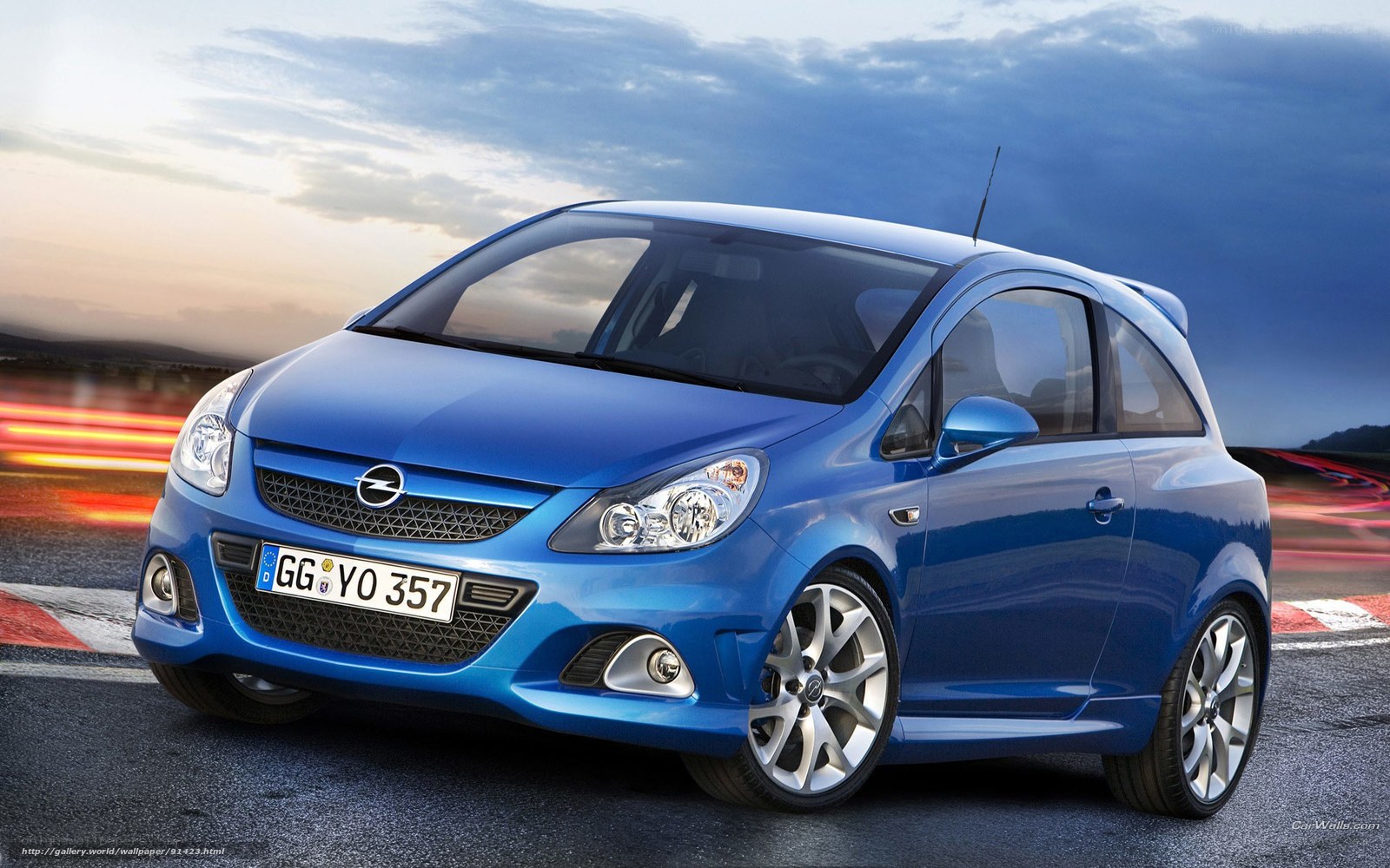 Blue Opel Corsa on a racetrack